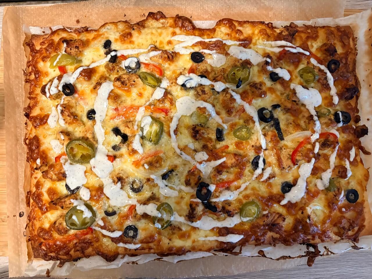 Ranch chicken pizza before baking with mozzarella and toppings